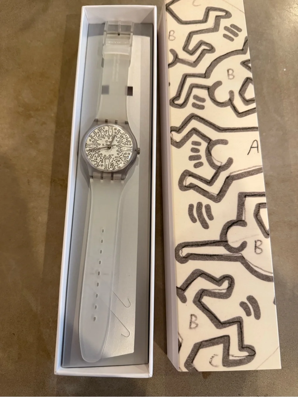 Swatch Translucent Strap Watch with White Patterned Dial